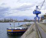 GMS Wolfgang Krieger, ankert im Rheinhafen Breisach, L=105m, Tonnage 2325t, 1612PS, Baujahr 1989, gemeldet in Remseck/Neckar, Jan.2025